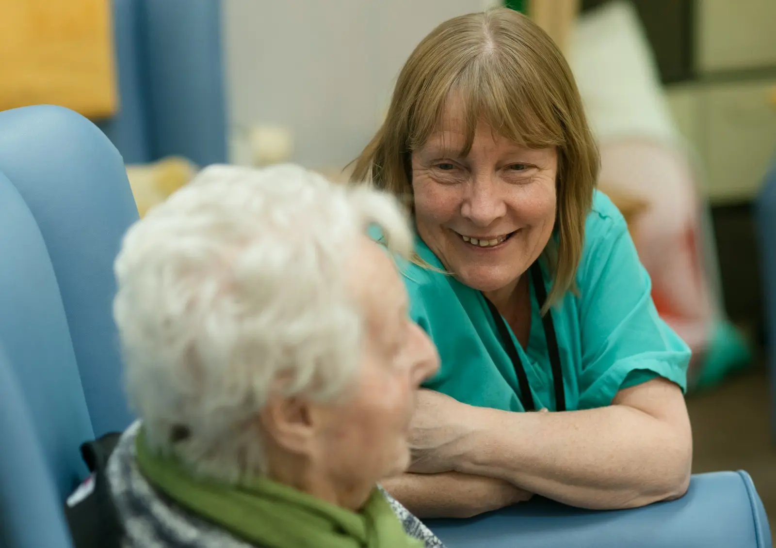 Care worker chatting with an older woman