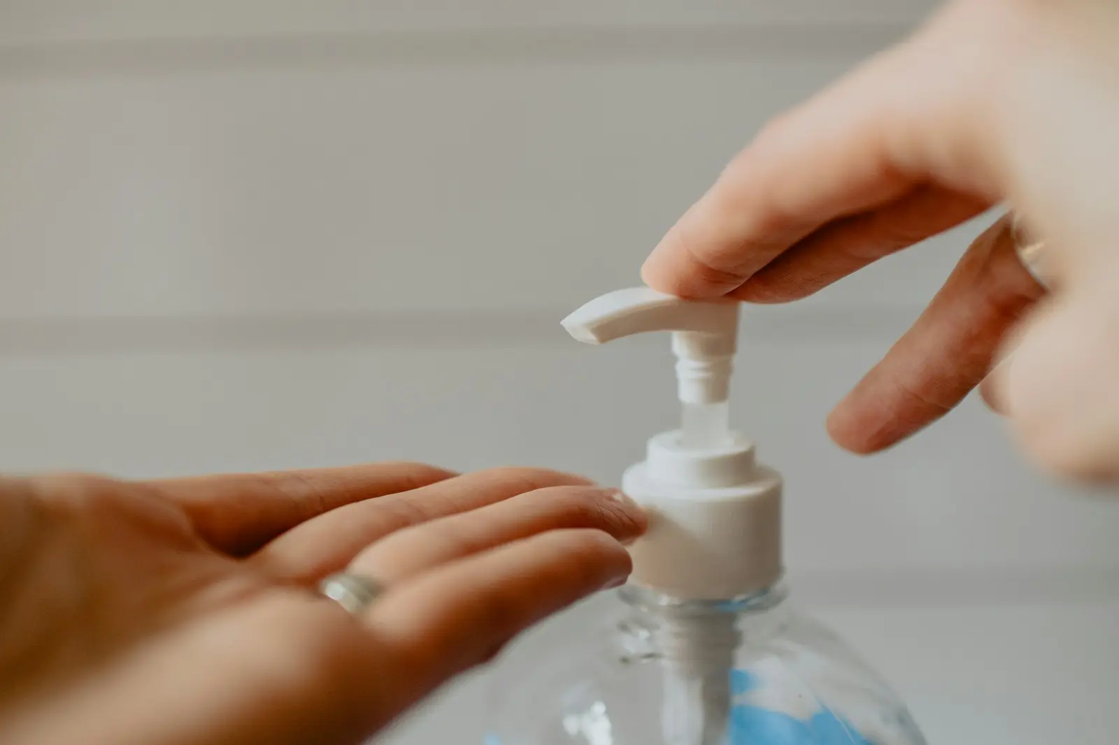 Hand sanitiser being pumped into a hand